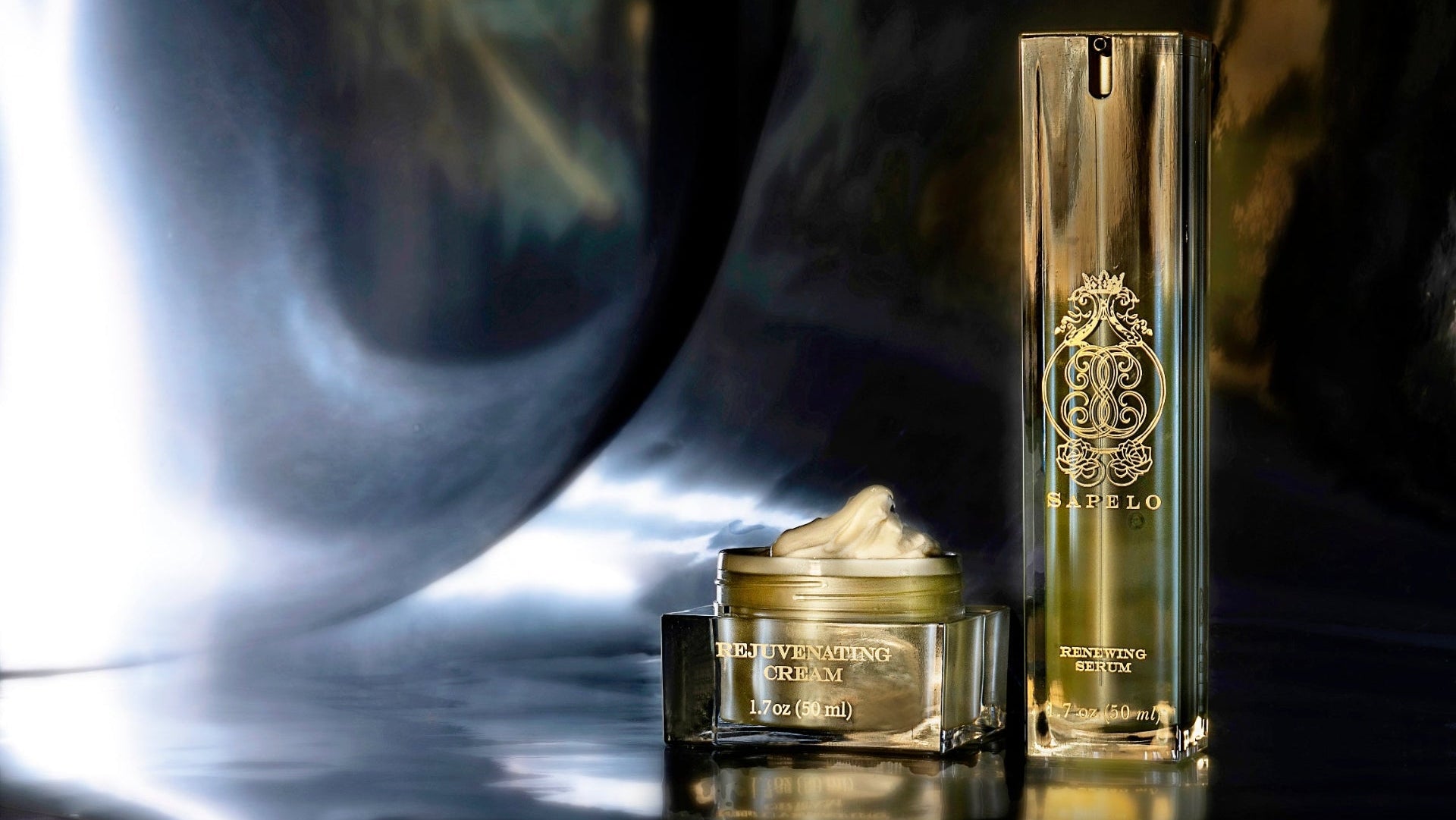 Skincare products with a brand logo on a reflective surface