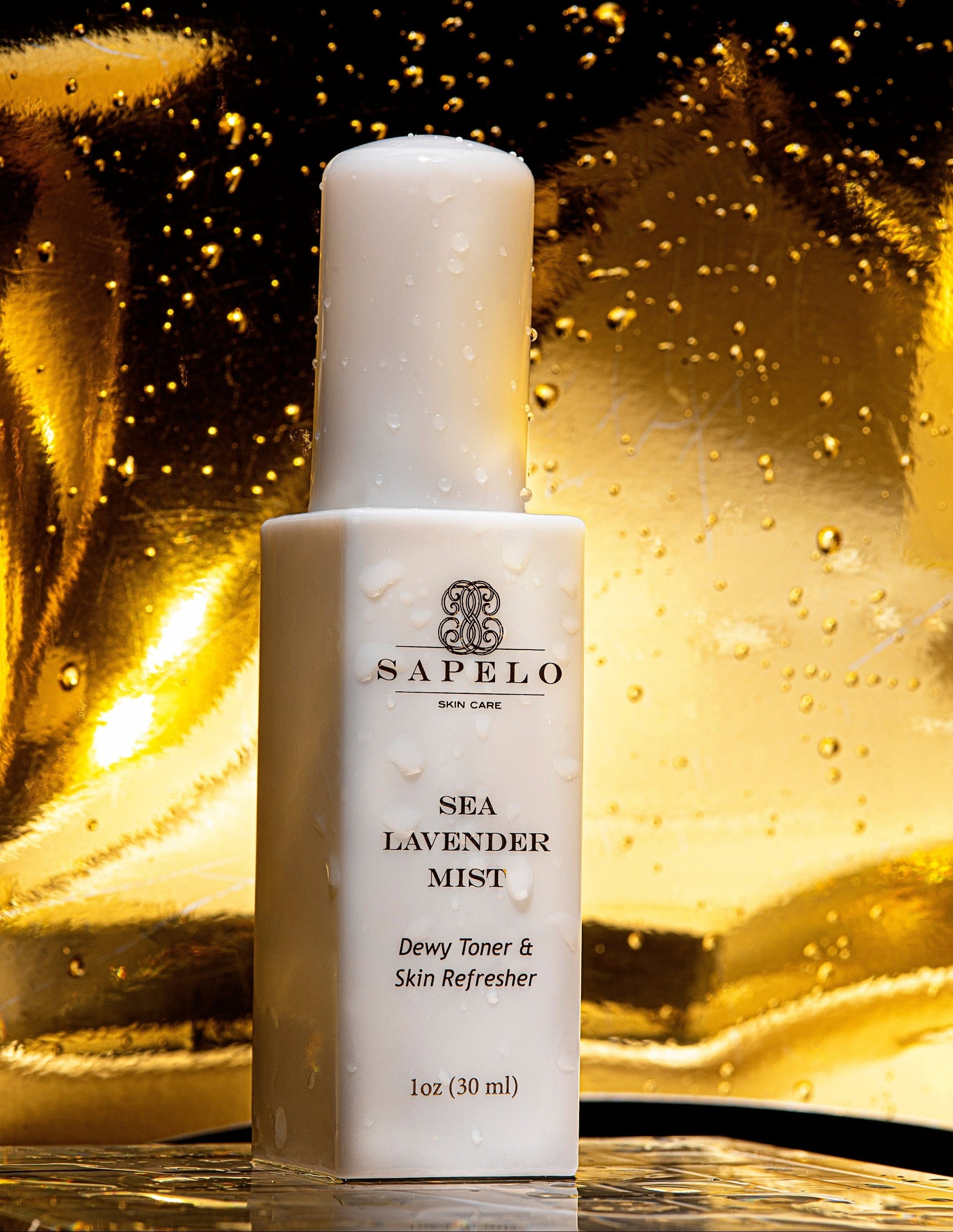 Sapelo Sea Lavender Mist bottle on a reflective gold surface