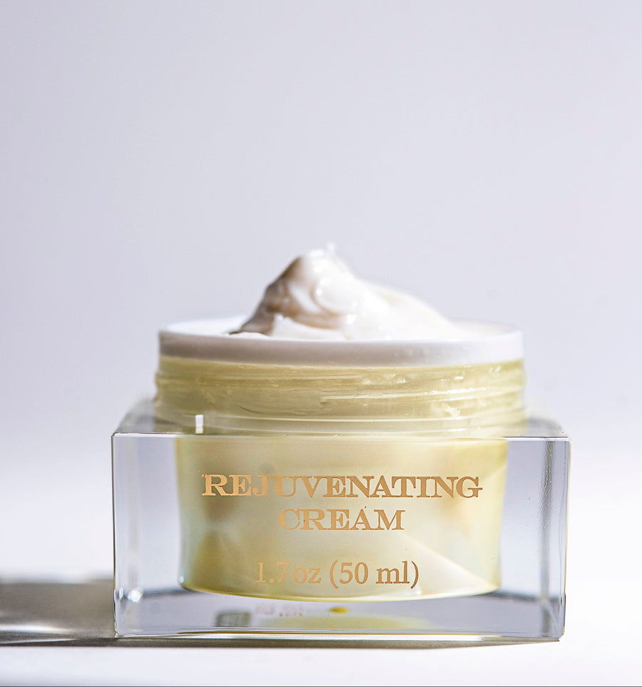 Jar of rejuvenating cream on a light gray background