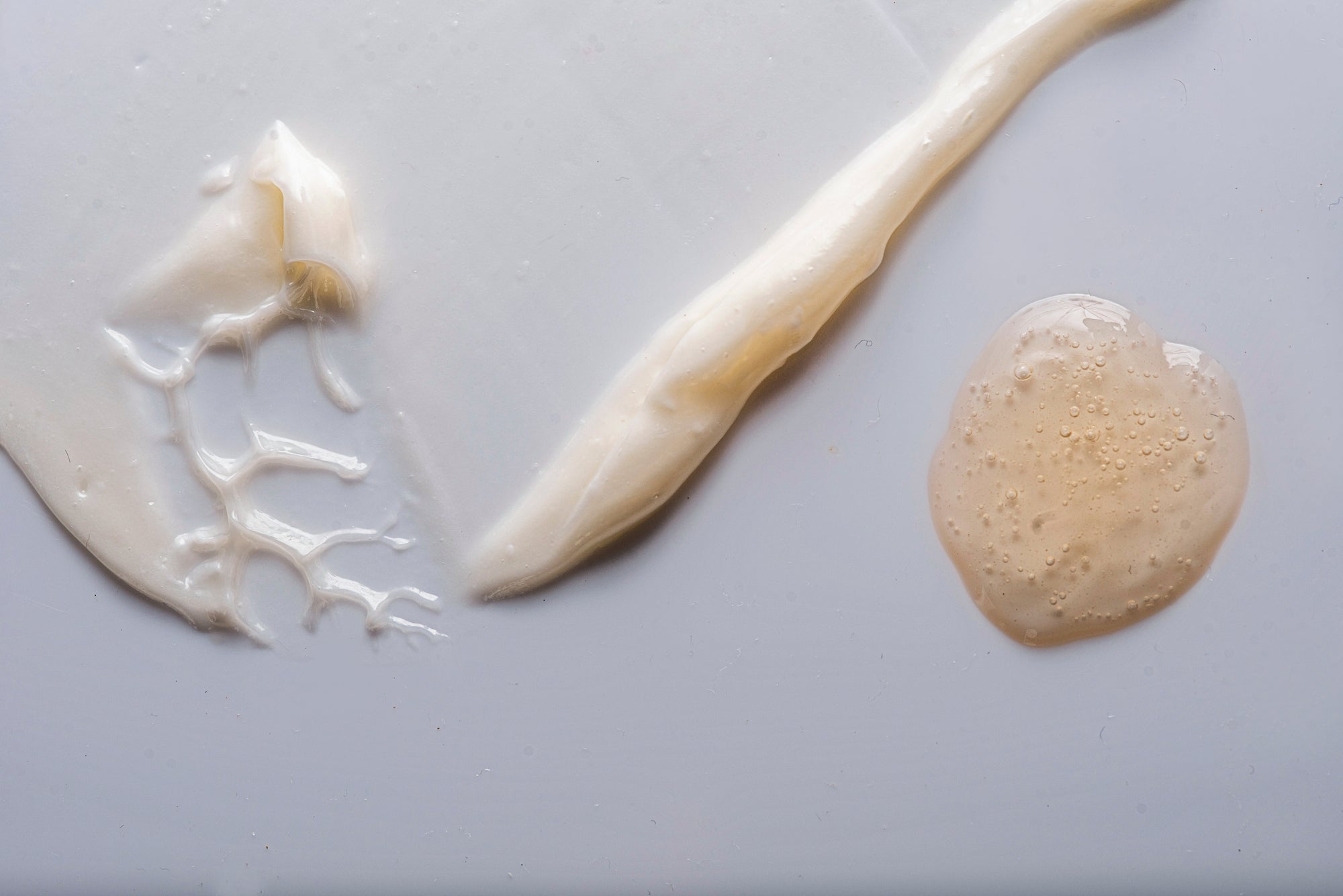 Close-up of a beige cream or paste on a white background